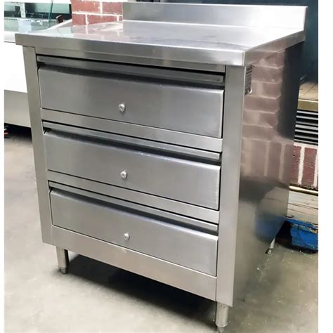 stainless steel cabinets and drawers alongside restaurant stove|enclosed kitchen cabinets.